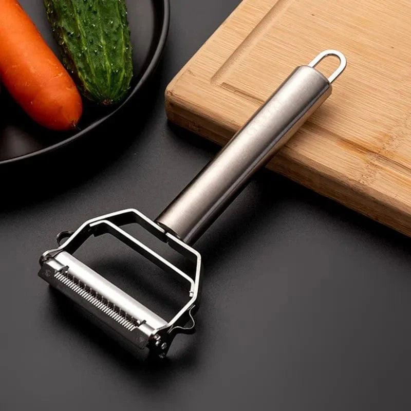 Showlu Fashion Store stainless steel vegetable peeler with sharp blades for peeling, slicing, and shredding potatoes, carrots, and fruits.
