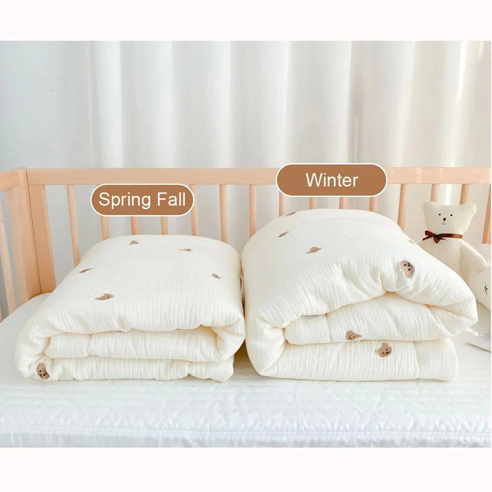 Showlu Muslin Baby Blanket featuring a cute bear and bunny pattern, made of 100% cotton for newborn swaddling and bedding.