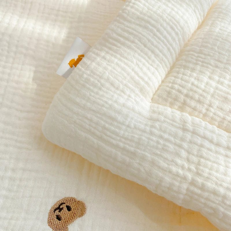 Showlu Muslin Baby Blanket featuring a cute bear and bunny design, made of 100% cotton for newborn swaddling and crib bedding.