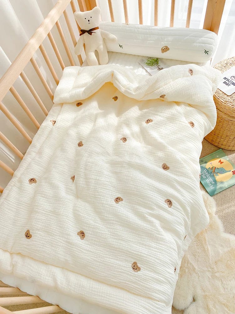 Showlu muslin baby blanket featuring a cute bear and bunny design, made of 100% cotton for newborn swaddling and crib bedding.