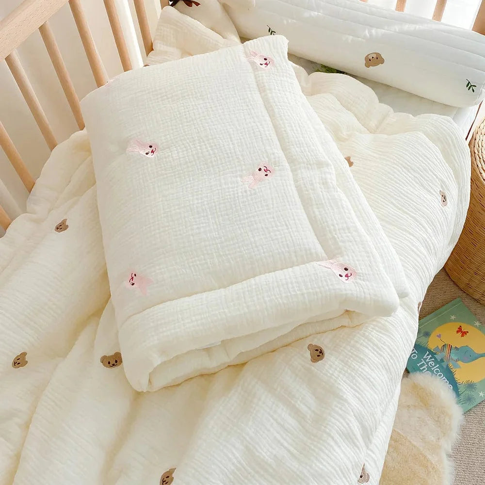 Showlu Muslin Baby Blanket with bear and bunny print, 100% cotton swaddle wrap for newborns, soft bedding accessory.