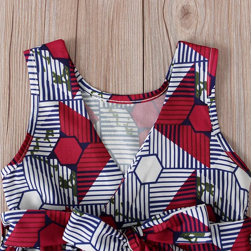 Girl wearing Showlu Fashion Summer African V-Neck Sleeveless Dress with colorful polyester print, perfect for warm weather.