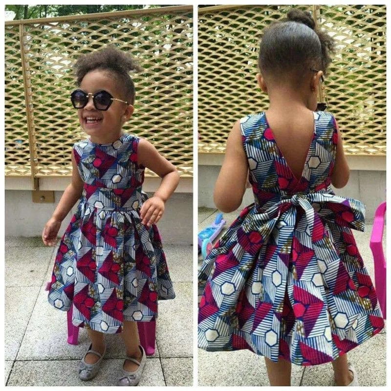 Girls African V-neck sleeveless summer dress by Showlu Fashion Store with colorful polyester print, perfect for warm weather.