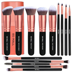 A set of fourteen makeup brushes with black handles and rose gold ferrules.