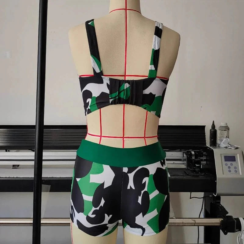 Camouflage print open-back two-piece bikini swimsuit by Showlu Fashion with sexy design and separate top and bottom.