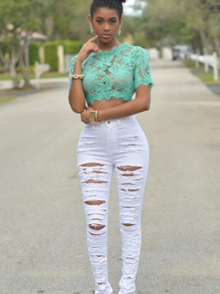 Liva Girl high waist ripped skinny jeans by Showlu Fashion, black elastic denim with distressed details and slim fit design.