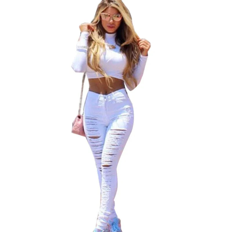 Liva Girl high waist ripped skinny jeans by Showlu Fashion, black and white elastic denim pants with distressed details for women.