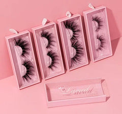 Four pairs of fluffy 3D mink false eyelashes in individual pink rectangular packaging.
