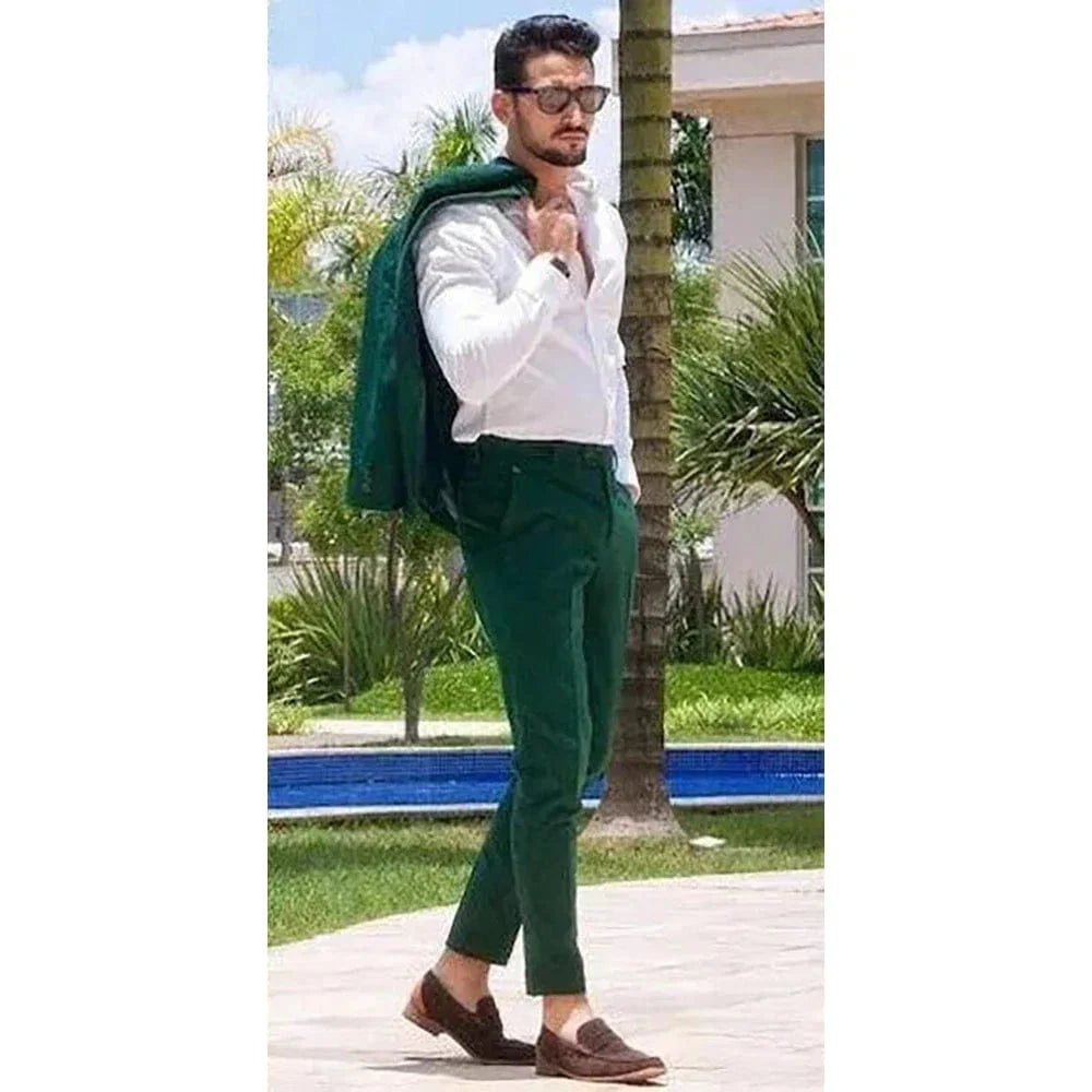 Green slim fit men's suit by SHOWLU FASHION, featuring a tailored jacket and pants, ideal for formal or stylish occasions.