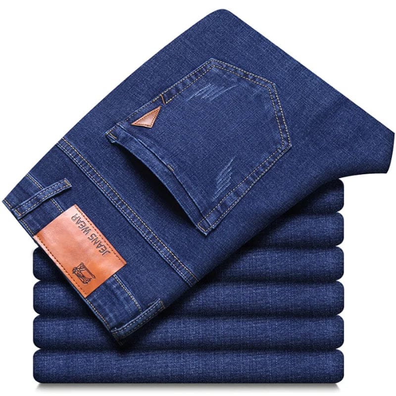 Men's SHOWLU slim fit straight leg denim jeans with comfortable stretch, casual style, and light luxury design.