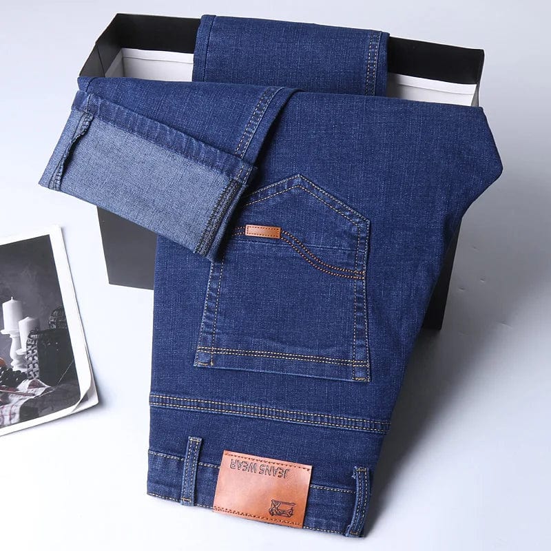 SHOWLU Men's slim fit straight leg denim jeans with comfortable stretch fabric, casual style, and modern design.