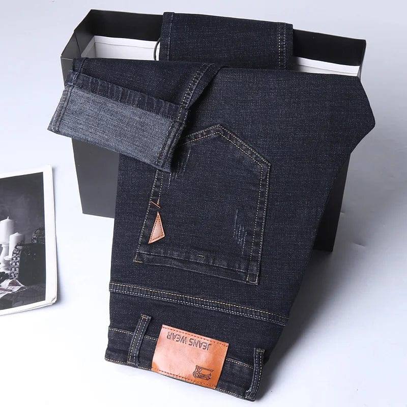SHOWLU Men's slim fit straight leg denim jeans, soft stretch casual pants with a modern fit and light luxury style.