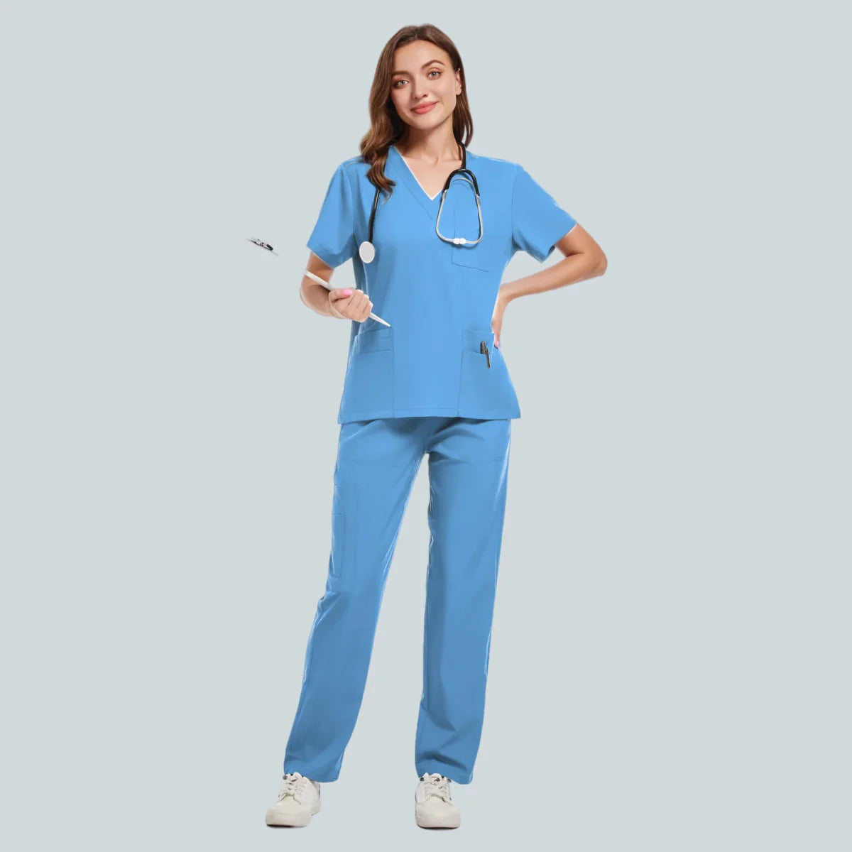Unisex medical scrub set with a sweatshirt and pants, designed for nurses and healthcare professionals, in a hospital setting.