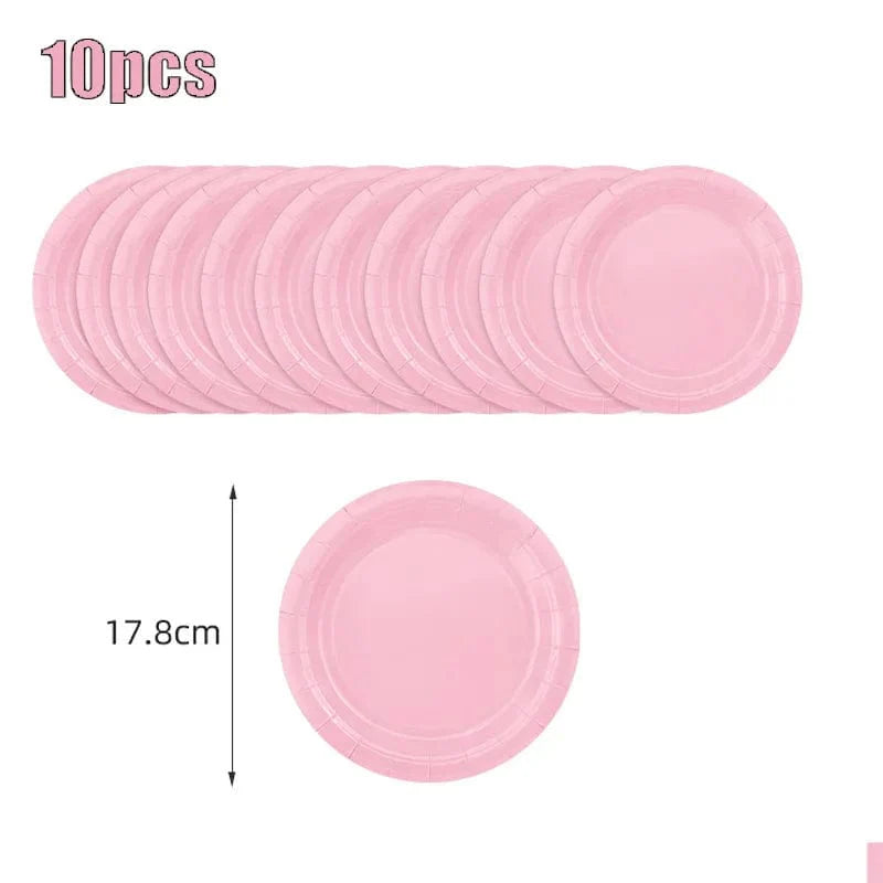 Light pink disposable tableware set with paper plates, cups, and tablecloth for kids' parties and baby showers.