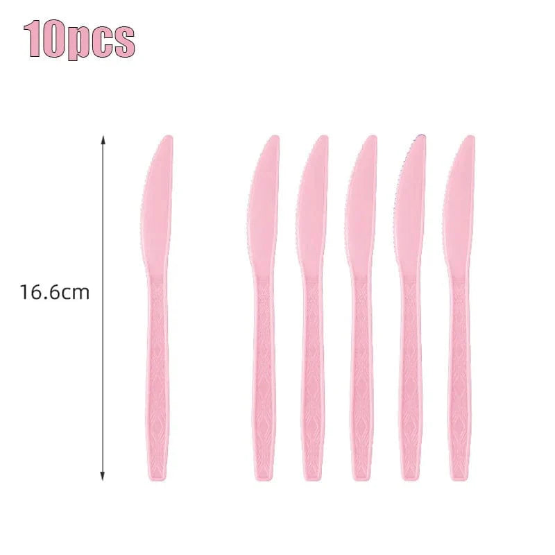 Light pink disposable tableware set with paper plates, cups, and tablecloth for kids' parties and baby showers.