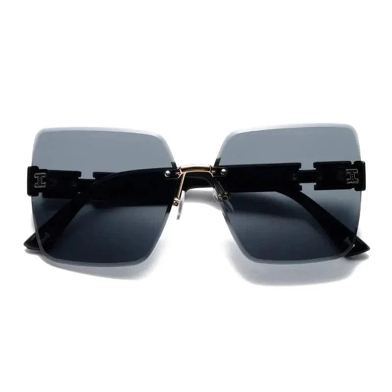 Showlu Women's Rimless Square Sunglasses with big frame, cut-edge design, UV400 protection, stylish eyewear for ladies with round faces.