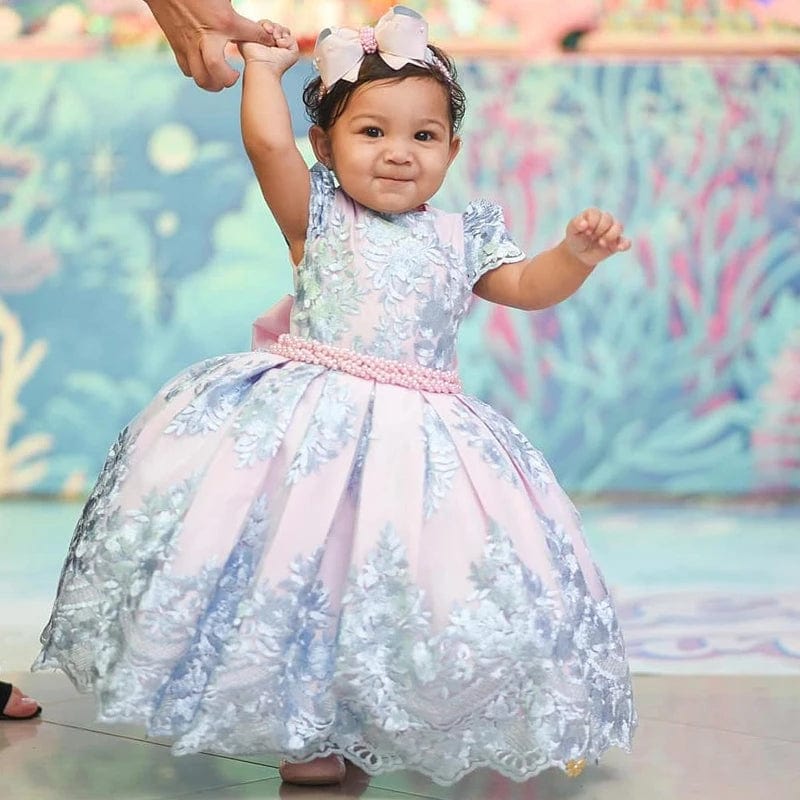 Girls princess party dress with a large bow, floral design, formal ball gown style, perfect for weddings, pageants, and special occasions.