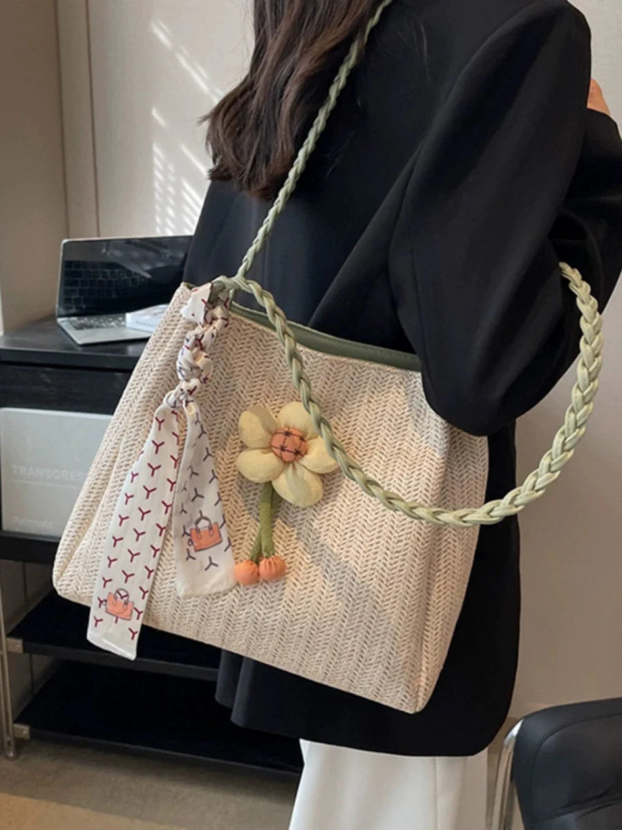 Large capacity Soo Cat woven straw bucket bag with shoulder strap, ideal for summer outings and casual travel.