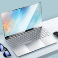 Showlu Fashion Store AKPAD 15.6-inch laptop with Intel J4125, 12GB RAM, 1TB SSD, Windows 11 Pro, HDMI port, portable design.