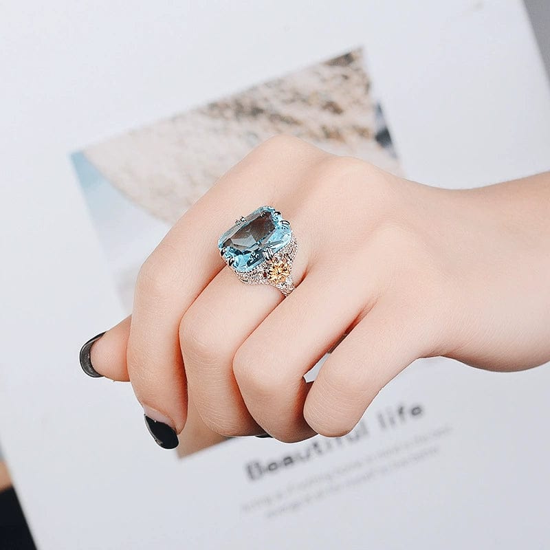 Ocean blue princess ring by Showlu Fashion with gold flower sterling silver inlay, elegant women's European and American style jewelry.