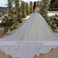 Elegant On Zhu Ball Gown wedding dress by Showlu Fashion with lace beaded appliques, off-the-shoulder neckline, and sweetheart silhouette.