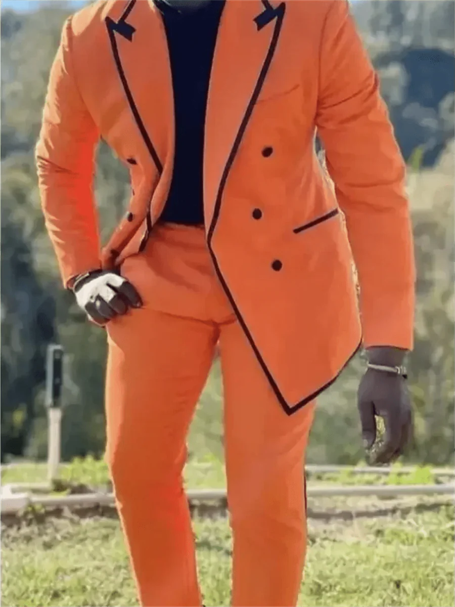 Orange men's 2-piece slim fit wool blend suit with peaked lapel, tailored blazer, and matching trousers for formal occasions.