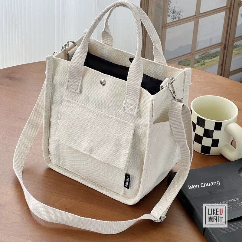 Showlu Fashion Hefan You Multi-Pocket Canvas Tote Bag with vertical square design and multiple compartments for versatile carrying.