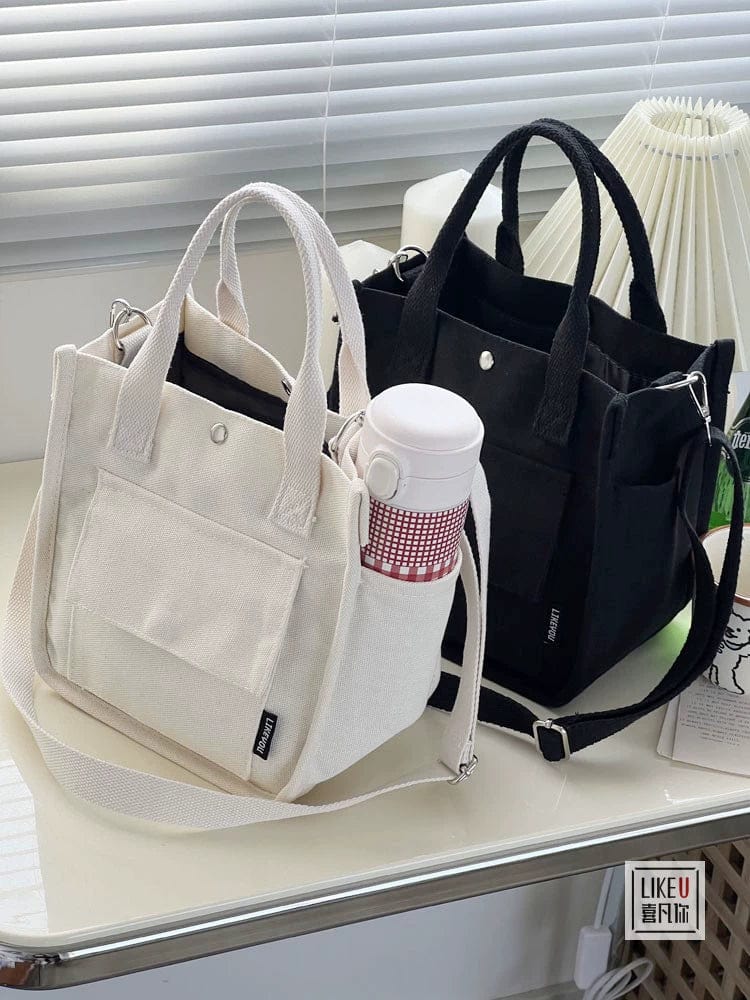Hefan You multi-pocket canvas tote bag by Showlu Fashion Store, vertical square crossbody design with multiple compartments.