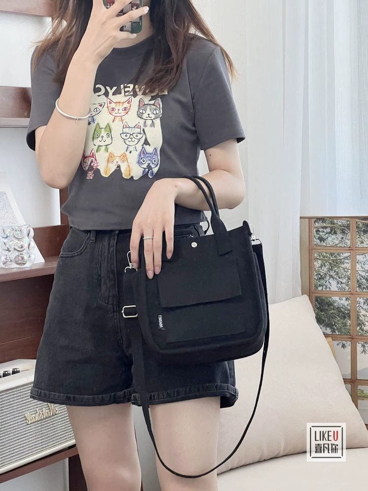Showlu Fashion Hefan You multi-pocket canvas tote bag with vertical square design and crossbody strap, showcasing its multiple compartments.