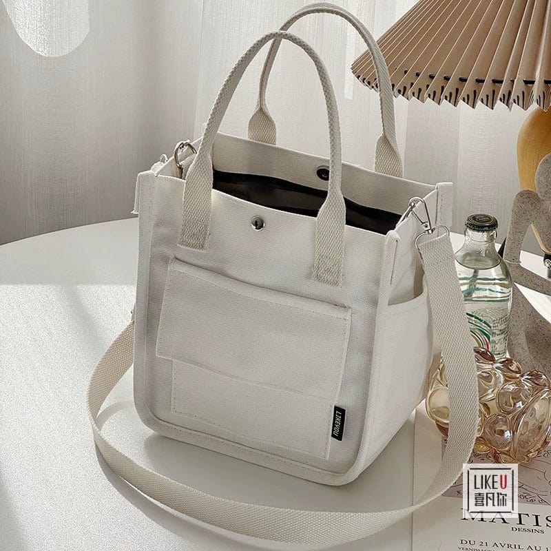 Hefan You multi-pocket canvas tote bag by Showlu Fashion Store, featuring a vertical square design with multiple storage compartments.
