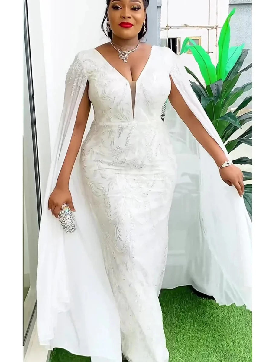 Plus-size African sequin dashiki Ankara maxi dress for women, elegant party and evening gown with a bodycon fit and vibrant details.
