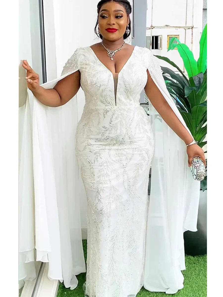 Plus-size African sequin dashiki Ankara maxi dress for women, featuring vibrant patterns, bodycon fit, and elegant evening style.