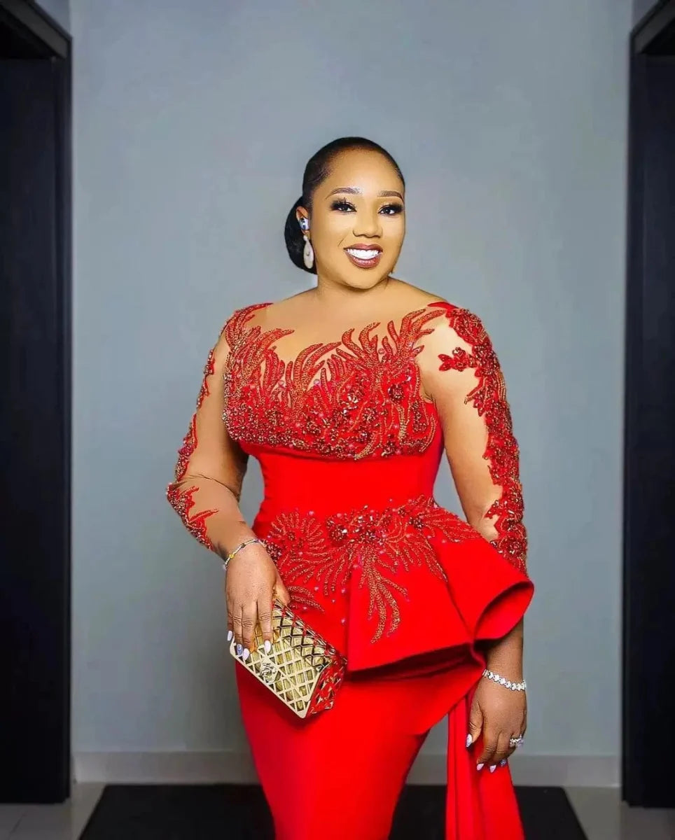 Plus-size red lace Arabic Aso Ebi prom dress with sheer long sleeves, appliques, sheath design, sweep train, elegant evening gown