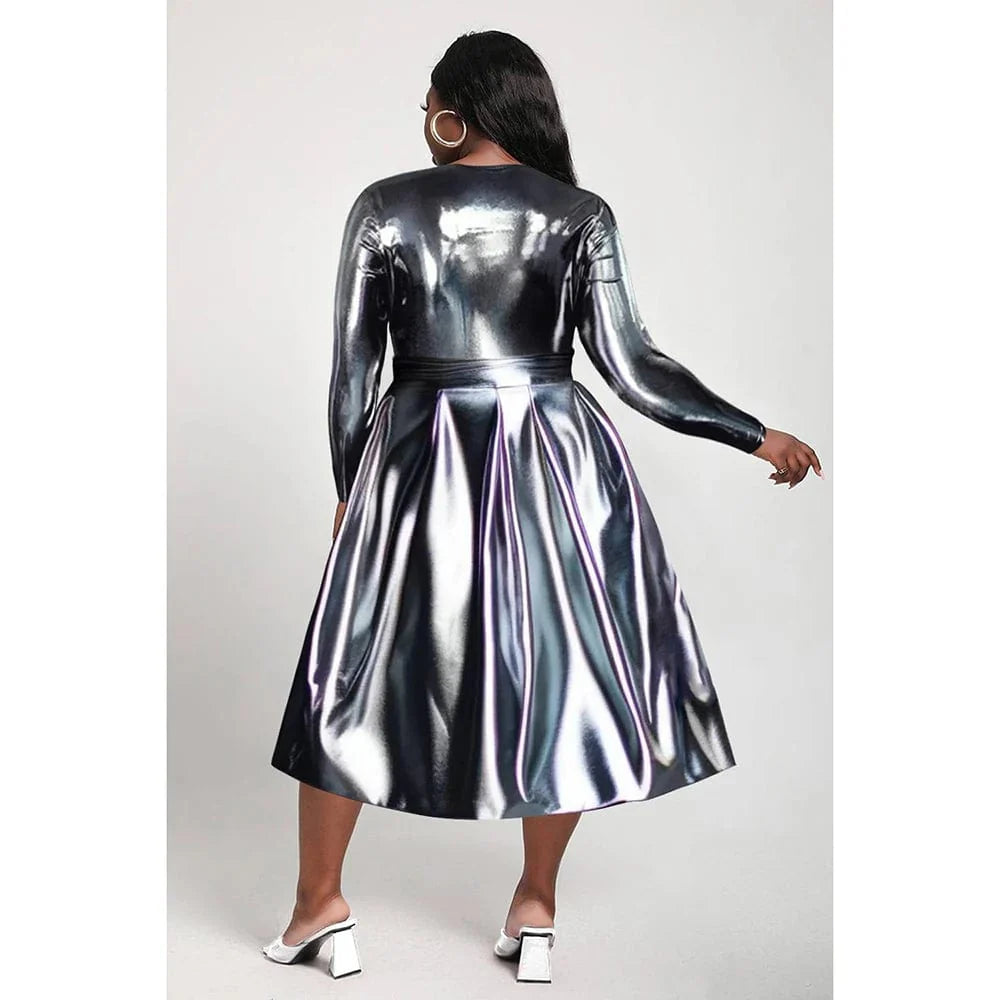 Plus size silver glitter long sleeve midi dress by Showlu Fashion, casual style with crew neck and shimmering fabric for fall and winter.