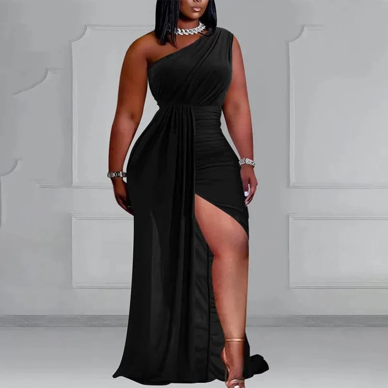 Plus size black one-shoulder pleated evening dress for women, featuring high slits and elegant design for spring and summer occasions.