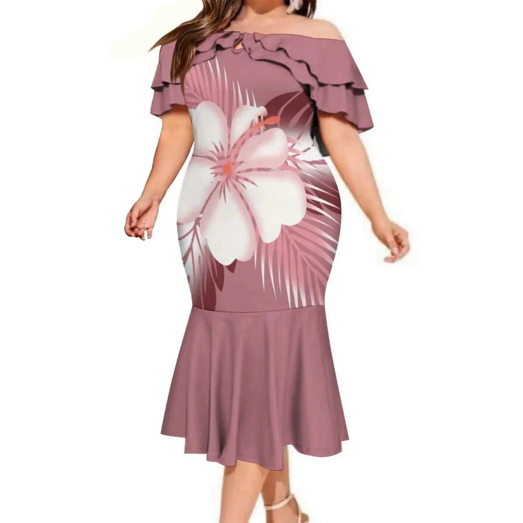 Shows a Polynesian couple in Fijian print fishtail dress and men's pocket shirt, featuring traditional Fijian design and vibrant patterns.