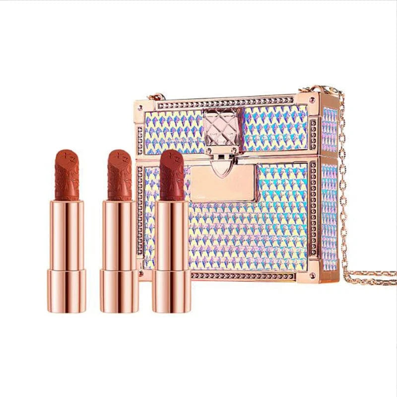 Showlu Fashion Store 3-piece matte lipstick and lip balm set with glitter chain bag, featuring moisturizing velvet finish and sleek design.