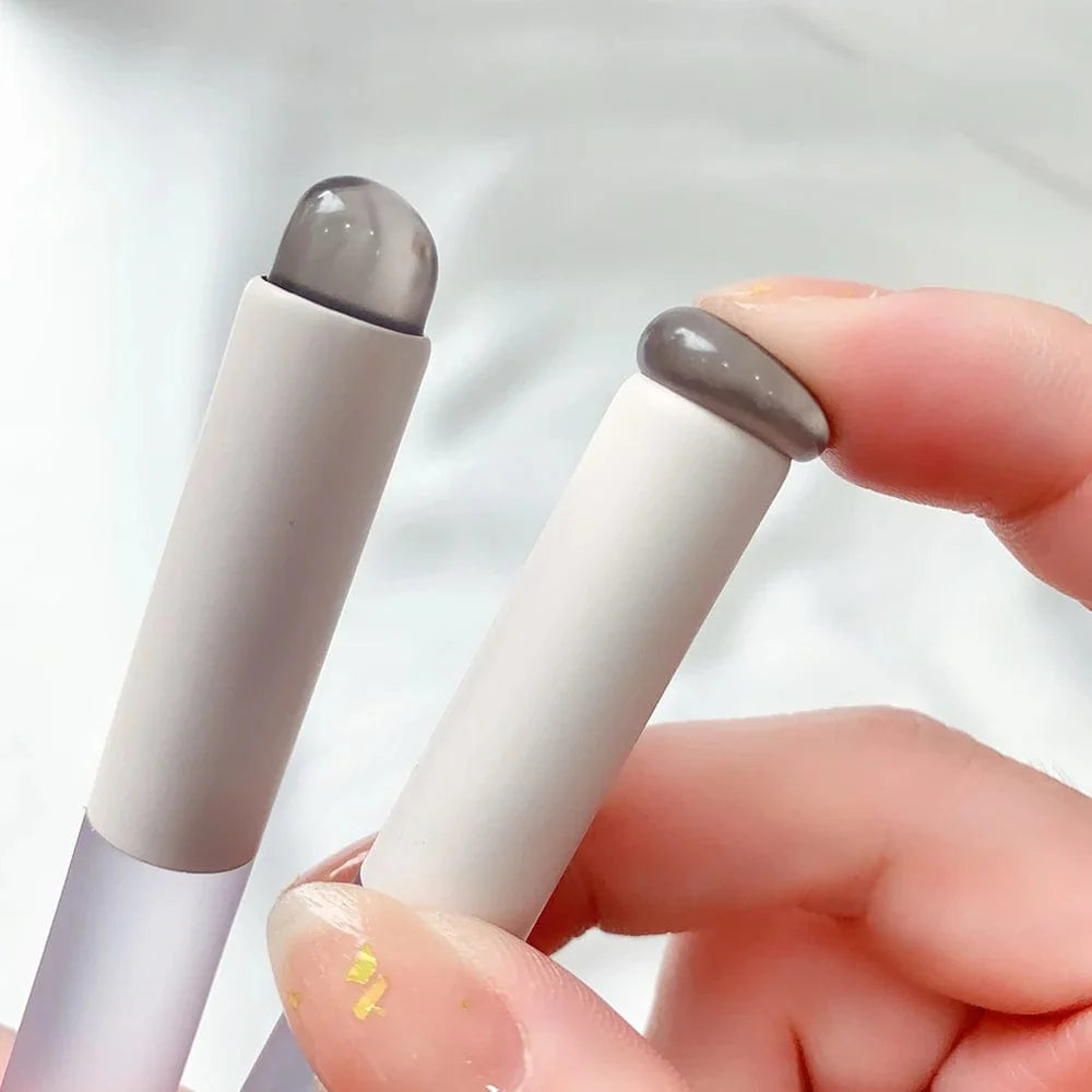 Silicone lip brush with dust-proof cover by Showlu, round head lipstick applicator, versatile makeup tool for lips and eyes.