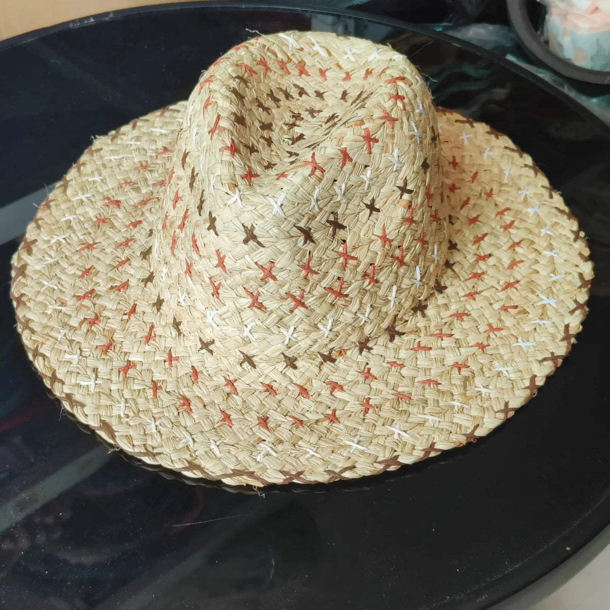 Colorful raffia straw Panama hat for women with bohemian style, perfect for summer beach and vacation sun protection.