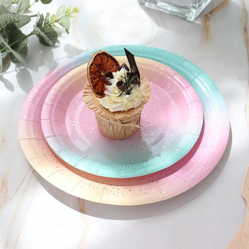 Showlu Rainbow Birthday Party Tableware Set with colorful paper plates, napkins, and cups for festive celebrations.