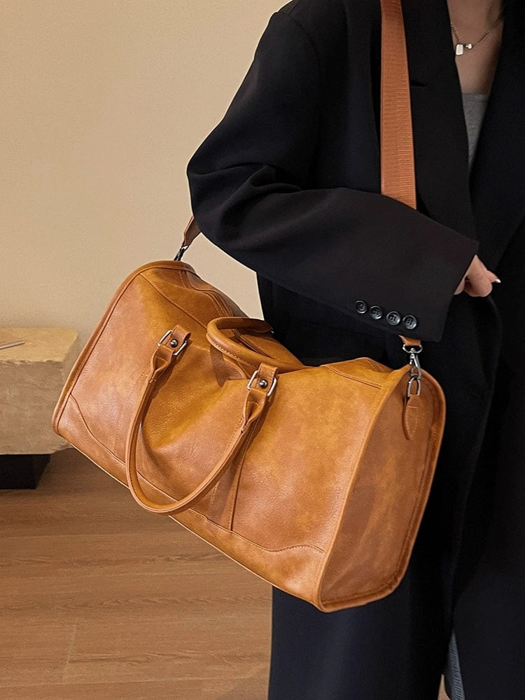 Showlu Retro PU leather travel bag for women, large crossbody luggage with textured finish and hand-held design.