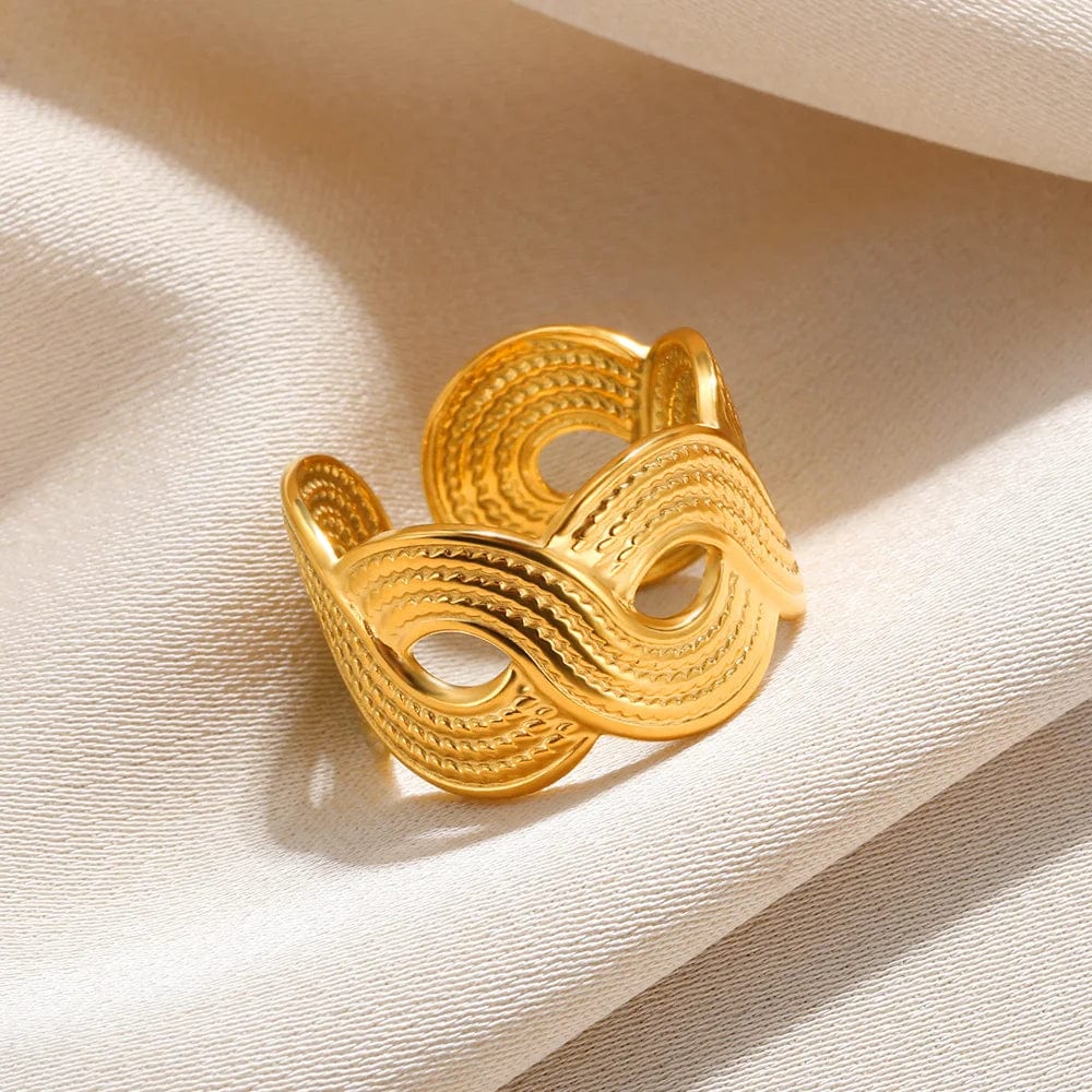 Showlu Women's vintage gold stainless steel angel feather ring, detailed jewelry design for women, elegant finger accessory.
