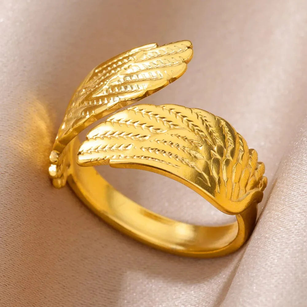 Showlu Women's vintage gold stainless steel angel feather ring, delicate jewelry for women, stylish finger accessory.