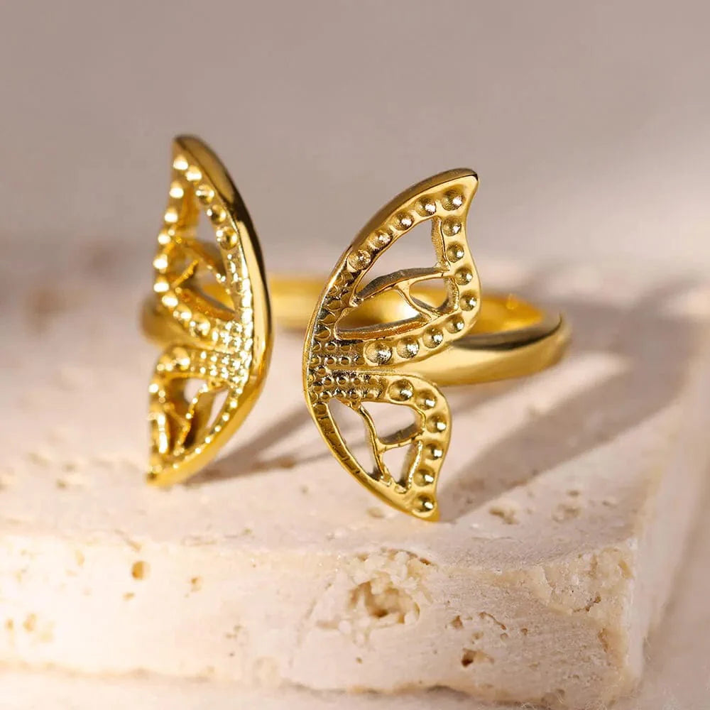 Showlu Women's vintage gold stainless steel angel feather ring with intricate feather design, stylish jewelry for women.
