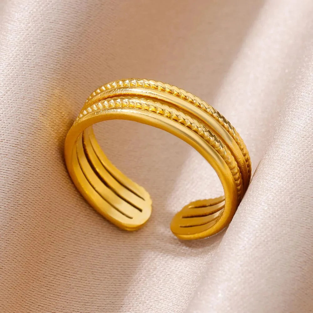 Showlu Women's Vintage Angel Feather Ring in gold stainless steel, featuring a delicate feather design on a sleek band.