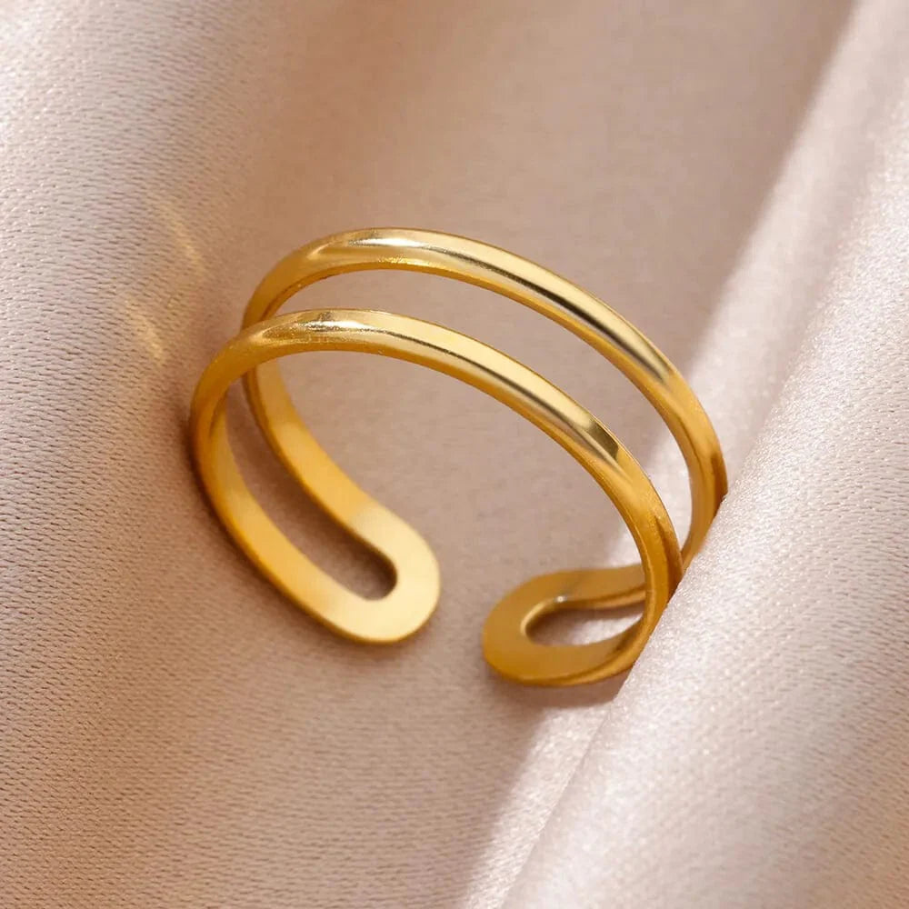 Showlu Women's vintage gold stainless steel angel feather ring with intricate feather design and elegant band for female jewelry accessories.