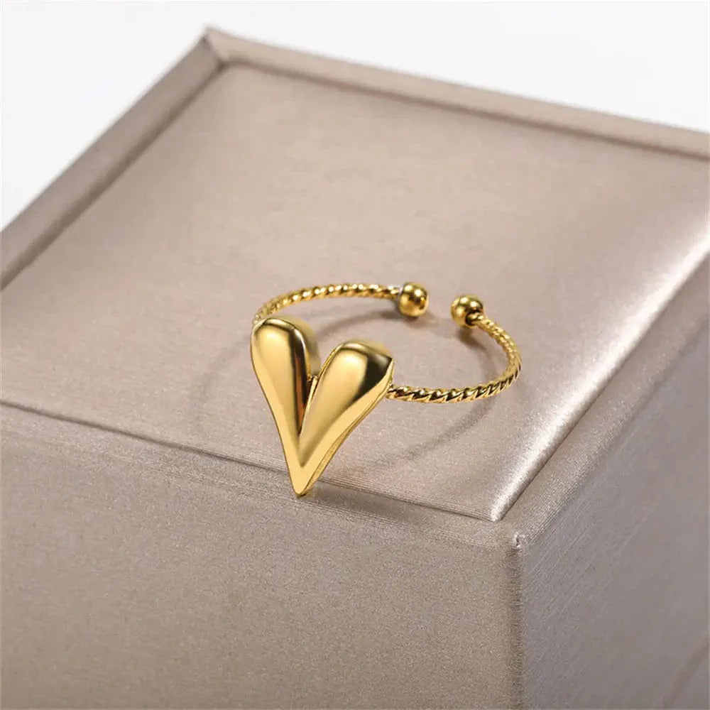 Showlu Women's Vintage Angel Feather Gold Stainless Steel Ring featuring a delicate feather design and elegant band.