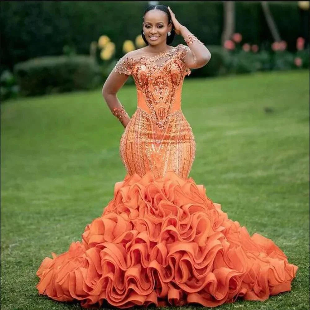 Orange mermaid evening dress by Showlu Fashion with lace, ruffles, and glitter bead details, perfect for formal occasions and parties.