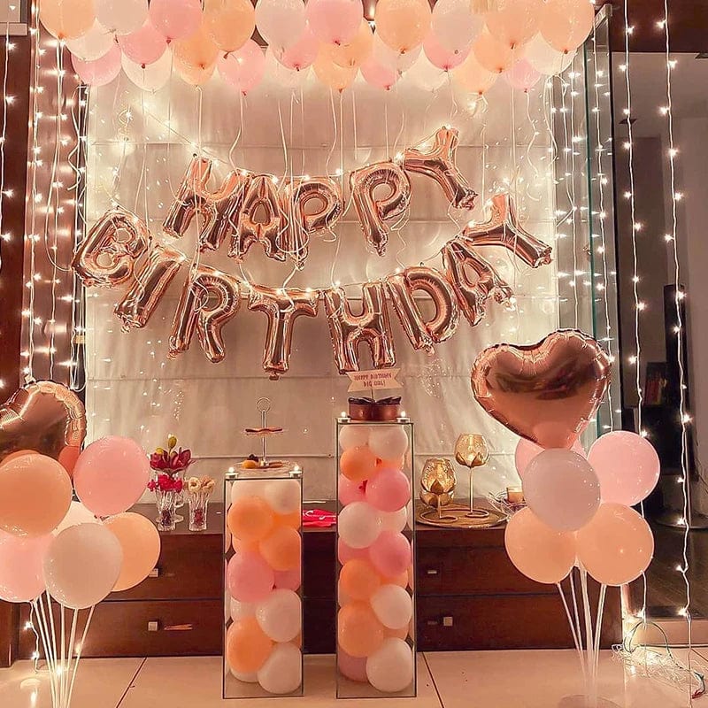 Rose gold disposable tableware set with paper plates, cups, and napkins for birthday and wedding celebrations.