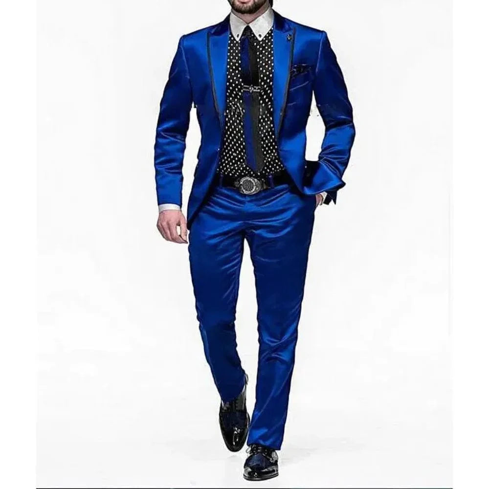 Royal blue satin men's 2-piece slim fit suit by Showlu Fashion, featuring a shawl lapel tuxedo with blazer and pants for formal occasions.